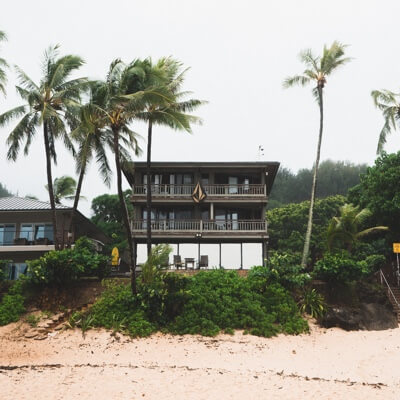 An outside view of a beach house.