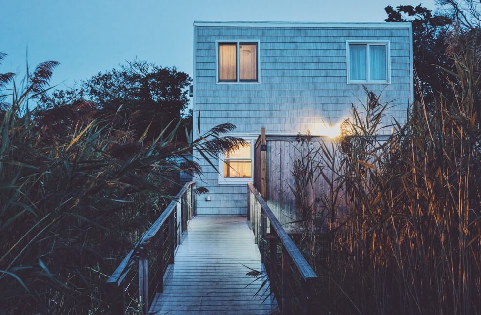 A picture from a pathway leading to a beach house.